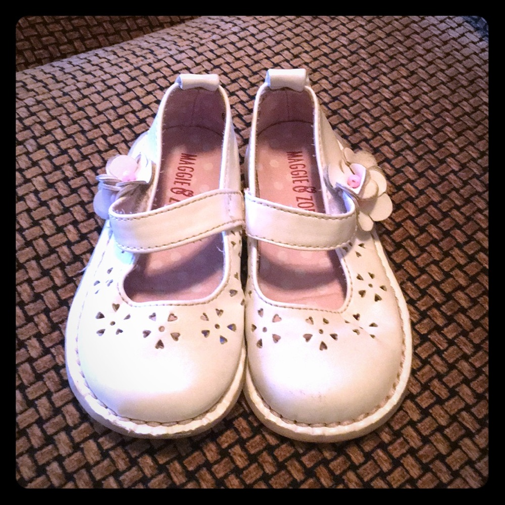 White mary janes with floral cutouts; size 6